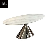 Table à manger ovale en marbre de luxe moderne avec une base en métal chromé poli, adaptée aux villas, aux maisons, aux hôtels, aux restaurants