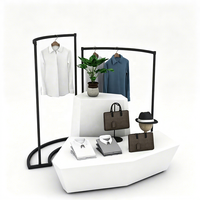 Présentoir à vêtements certifié ETL, en métal noir, courbé, autoportant, avec table de présentation pour boutique