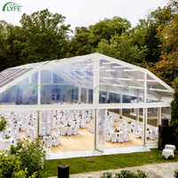 Tente de réception extérieure Lyfe en aluminium robuste à double étage avec murs en verre, structure arquée coupe-vent pour salons professionnels et événements variés