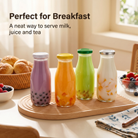 Bouteille de jus en verre transparente ronde de luxe de 16 oz et 32 oz pour le lait avec bouchon à vis en métal