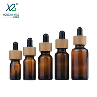 Bouteilles en verre en gros de 10 ml, 30 ml, 100 ml avec couvercles en bambou pour crème visage, gouttes pour les yeux, huile essentielle, mascara, compte-gouttes sérigraphié