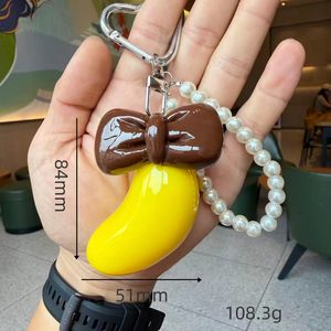 새로운 창의적인 바나나 리본 키체인, 귀여운 카와이 진주 가방 참, 달콤한 소녀풍 백팩 펜던트, 여성을 위한 독특한 작은 선물 - Product Image 4