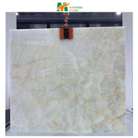 Dalle de marbre blanc de l'âge glacial naturel, marbre onyx blanc, mur rétroéclairé, table à manger photoélectrique, îlot de cuisine, crédence