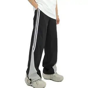 Pantalon en nylon baggy droit de sport à rayures latérales à ourlet réglable léger coupe-vent personnalisé