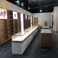Vitrine d'exposition pour téléphones portables avec logo personnalisé pour la décoration de magasin de téléphonie mobile
