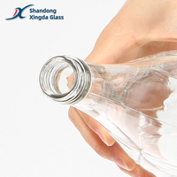 Logo personnalisé 250ml 500ml fantaisie vide verre clair eau minérale liqueur jus sirop bouteille avec bouchon à vis