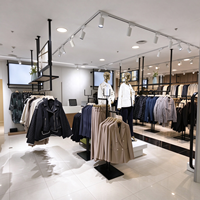 Portant à vêtements noir en métal tubulaire, étagère de présentation multi-niveaux, certifié CE ETL, vente en gros pour boutiques et détaillants