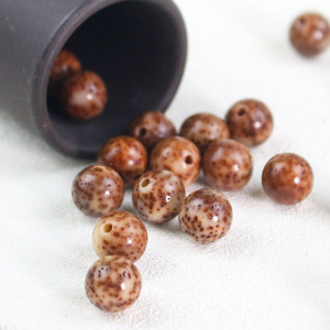 Perles de bois rondes en vrac de graines de Bodhi étoile et lune, 108 pièces, pour la fabrication de bracelets, polies de Hainan - Product Image 1
