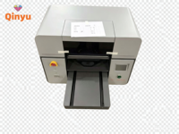 Machine d'impression DTG pour t-shirts Qinyu, nouvelle génération, haute vitesse, entièrement automatique, fonction d'agitation de l'encre blanche, encre textile USB