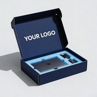 Boîte électronique rigide argentée avec logo personnalisé et insert en mousse bleue, emballage haut de gamme pour appareils portables et gadgets technologiques