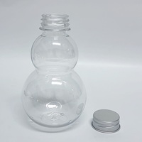 Bouteille de boisson en plastique PET populaire en forme de double gourde pour boissons gazeuses avec bouchon à vis