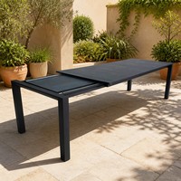 Table extensible d'extérieur en aluminium avec plateau en verre trempé gris roche, légère et durable, design moderne