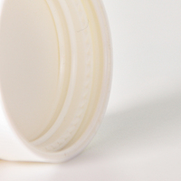 Bouchons en bakélite à dôme lisse en polypropylène blanc pour les pots de crème de soins de la peau