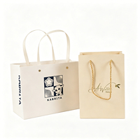 Tas Kertas Premium Warna Krem Beige Custom Berlogo, Tas Hadiah Mewah dengan Pegangan Pita untuk Butik Pakaian Bayi Anak-anak