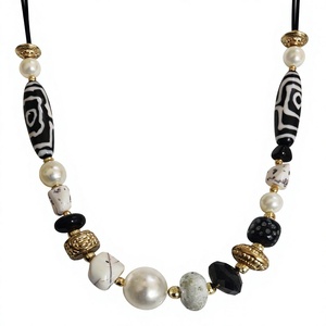 Bohemian Beaded Necklace with Beads Pearls and Black White Patterned Beads Gold Plated Unisex Statement Jewelry - Product Image 1