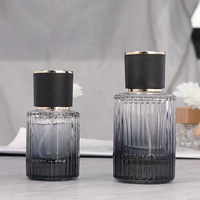 Flacon de parfum en verre à rayures verticales noir de luxe 50 ml avec bouchon rond et atomiseur, conteneur vide pour cosmétiques