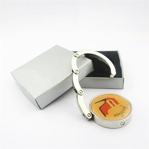 Porte-sac pliable portable en métal personnalisé avec logo <span class=keywords><strong>pour</strong></span> tables – Support de sac à main tendance - Product Image 1