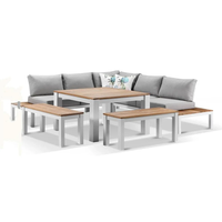 Ensemble de salle à manger rond d'extérieur en aluminium thermolaqué imitation chêne, 6 places, avec chaises et tables à coussins résistants aux taches