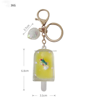 Porte-clés 2026 Eagle en acrylique, nouveau, avec liquide à effet sable mouvant et motifs de sucette glacée mignonne et de tasse de thé au lait, et huile flottante