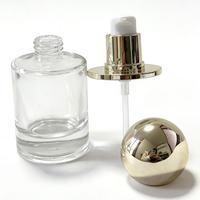 Flacon pompe cylindrique en verre personnalisé avec capuchon sphérique doré estampé à chaud, luxueux, vide, pour cosmétiques, crème et sérum de soin de la peau, Chine