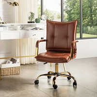 Chaise de bureau confortable et réglable en cuir, pivotante, avec pieds et accoudoirs dorés, idéale pour le télétravail ou le bureau.