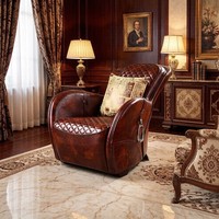 Fauteuil d'appoint vintage en cuir avec ottoman, matelassage losanges, détails anneaux métalliques, chaise longue individuelle rétro pour bureau ou bar