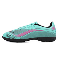 Chaussures de football à crampons TF à lacets et coupe basse pour terrain synthétique, base blanche avec motif de lignes ondulées vert néon et noir, pour entraînement de football en salle