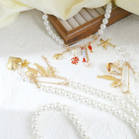 Collier de perles avec pendentif épingle de sûreté Série Océan, Chaîne de clavicule de luxe de niche, Bijou tendance unique et affirmé pour femme