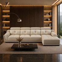 Canapé modulaire en cuir véritable beige, moderne, en forme de L, avec fauteuil inclinable électrique, console centrale, éponge écologique, personnalisable OEM, pour concessionnaires