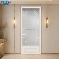 Porte de salle de bain en verre intérieur avec verre décoratif texturé, cadre minimaliste en grille noire, surface finie pour hôtels et villas
