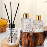 Bouteille diffuseur de parfum en verre vide transparente ronde 50ml 100ml 150ml avec bouchon à vis et bâtonnets diffuseurs, prix usine de gros, écologique