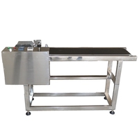 Automatic reversing conveyor feeder date code machine cards separator