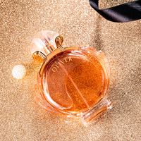 Feminines Parfüm in Kugelförmiger Klarglasflasche mit Blassrosa Flüssigkeit, Knopfkappe und Roségold-Kragen - Ätherische Haltbarkeit