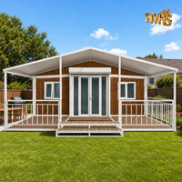 Maison mobile HeYing, conteneur de 20 pieds, structure blanche, revêtement en bois grainé, véranda extensible à double aile, imperméable, bureau moderne