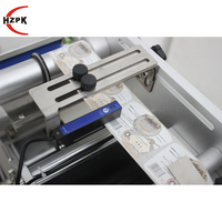 Etiqueteuse de bureau semi-automatique HZPK à surface incurvée et double plan auto-adhésive pour bouteilles et boîtes