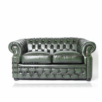 Canapé classique en cuir véritable, style Chesterfield antique, pour salon européen.