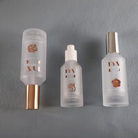 Nouveauté Flacons en verre givrés à pompe à lotion à épaule inclinée Emballage de soins de la peau avec pompe dorée 30ml 50ml 75ml 100ml 200ml