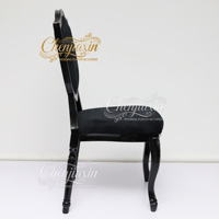Chaise de salle à manger moderne gothique noire en gros, dossier bouclier à boutons en cristal, chaise de mariage de luxe en velours de style français pour hôtel et fête