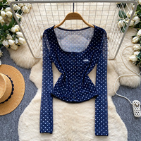 Chemisier d'été à pois pour femme, coupe ajustée, manches longues, boutonné, style peplum, idéal pour le bureau