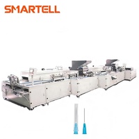 Machine de fabrication et d'assemblage d'aiguilles pour seringues hypodermiques à usage médical
