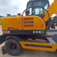 Excavatrice sur pneus d'occasion 7 tonnes XINYUAN 75, faible nombre d'heures, bon état, en stock à vendre