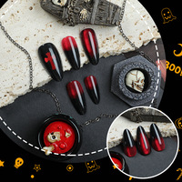 Vente en gros de faux ongles réutilisables en ABS, style Ins, en amande, à presser, motif œil de chat rouge et croix, 24 pièces par set