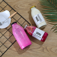 En stock, bouteilles en verre transparentes pour jus, boissons, lait, rondes, vides, de 10 oz, 12 oz, 16 oz, avec couvercle et logo personnalisé