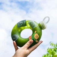 Vente en gros de bouteille en forme de beignet en plastique PP de 500ml avec bouchon à vis écologique pour boisson lait thé jus boissons gazeuses
