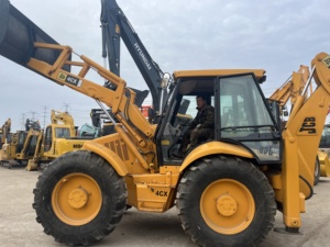 รถตักล้อยาง JCB รุ่น 4CX สีเหลือง มือสอง อุปกรณ์ก่อสร้าง น้ำหนักบรรทุก 9 ตัน เครื่องยนต์คัมมินส์ - Product Image 4