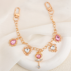 Nouvelle conception de chaîne de <span class=keywords><strong>sac</strong></span> <span class=keywords><strong>baguette</strong></span> magique vintage en or rose <span class=keywords><strong>avec</strong></span> cristal cœur rose, breloque de décoration de <span class=keywords><strong>sac</strong></span> à main tendance pour femmes - Product Image 1