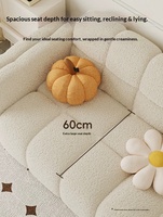 Canapé en tissu deux places de style moderne et minimaliste, avec structure en bois massif, idéal pour les petits appartements et salons.