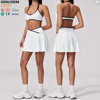 Ensemble 2 pièces OEM ODM : Jupe-short de tennis pour femme avec soutien-gorge dos nu et bordure contrastante, taille croisée, idéal pour le golf, le pickleball, la gym et l'entraînement sportif