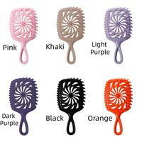 Brosse à cheveux évidée pratique pour démêler et masser, idéale pour coiffure sur cheveux secs ou mouillés