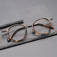 Nouveautés 0056 : Montures de lunettes rétro de haute qualité en acétate et titane pour lunettes optiques. Vente en gros de haute qualité.